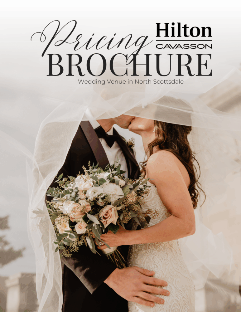 A bride and groom kiss under a veil, holding a bouquet of flowers. The image features text reading Hilton Cavasson Pricing Brochure: Wedding Venue in North Scottsdale.